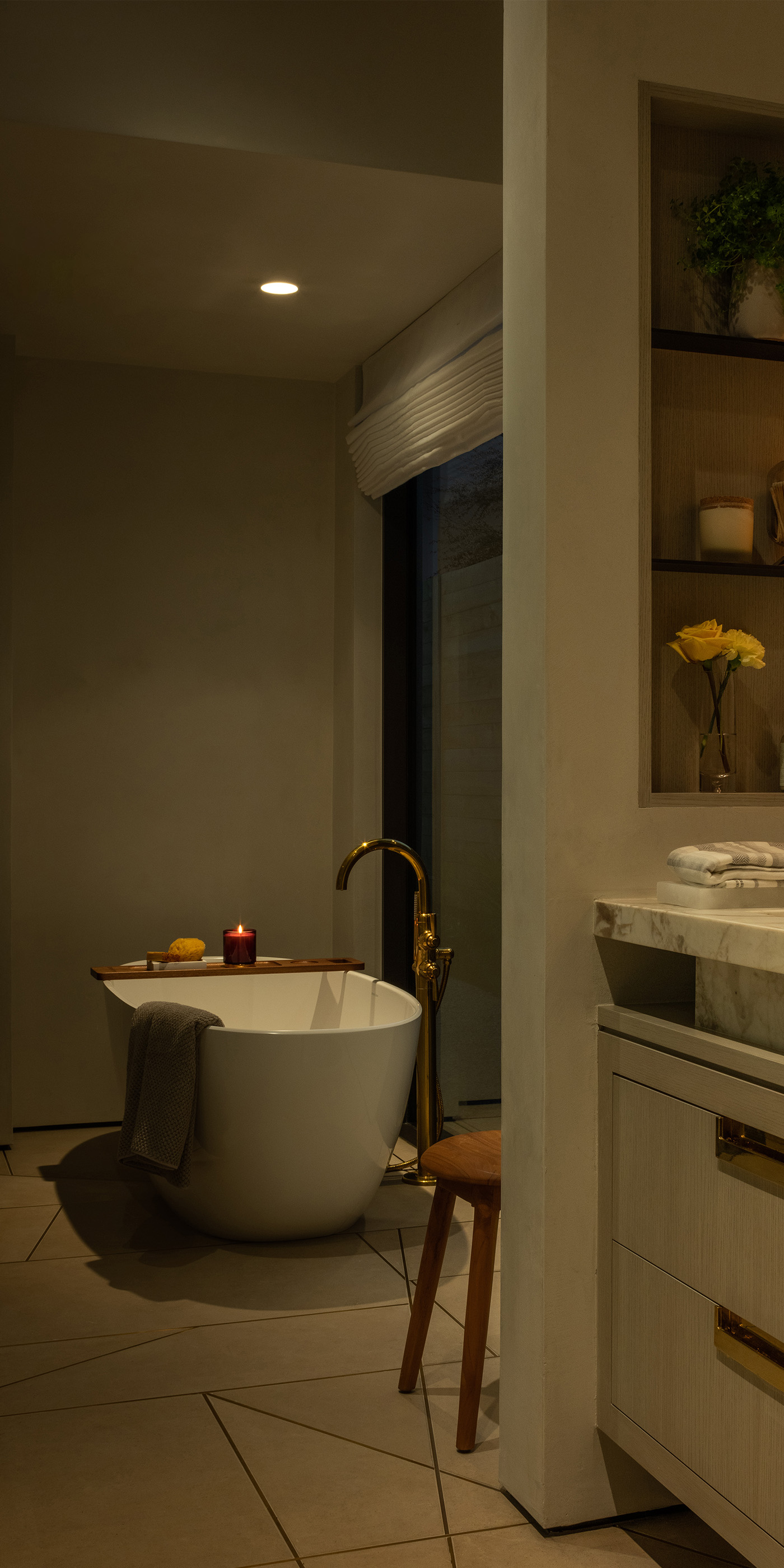 An Austin residential bathroom with Lutron Ketra lights, Roman shades, Sivoia and HomeWorks.