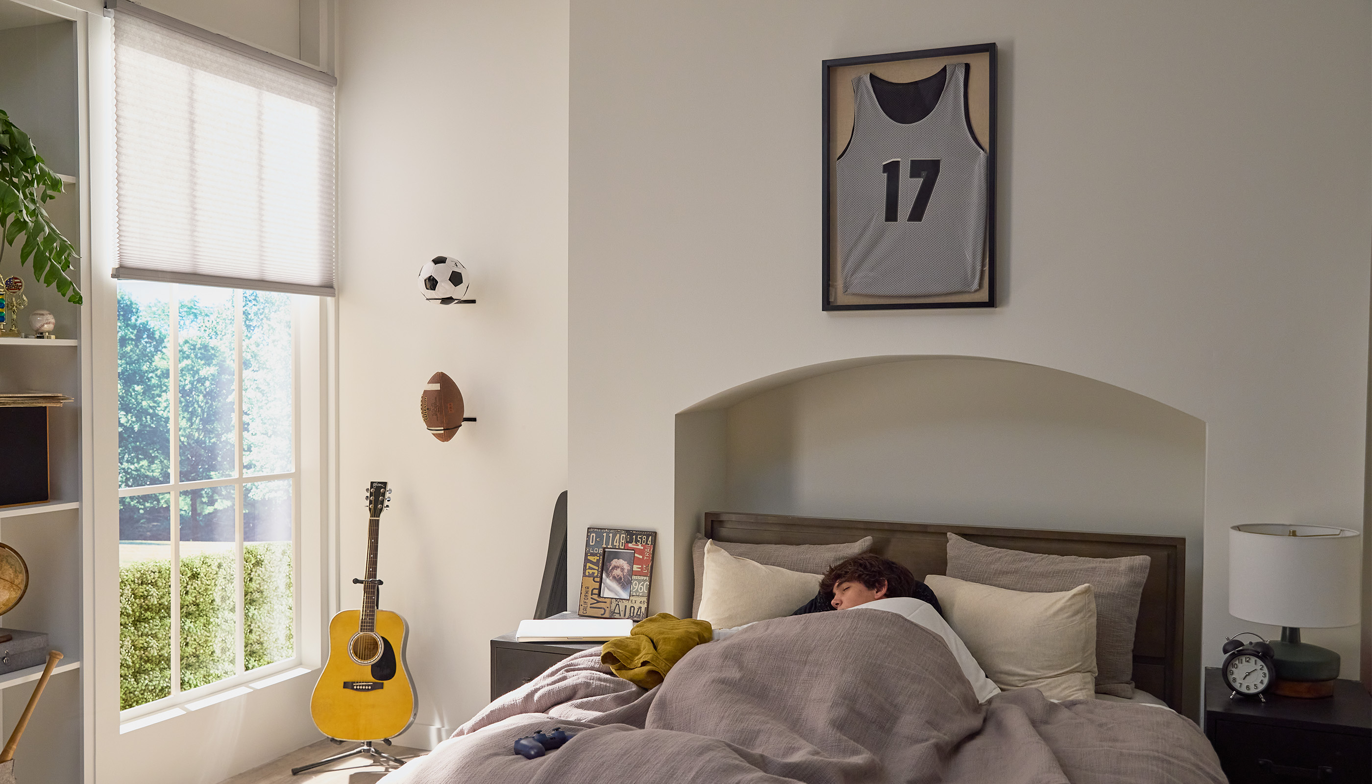 A Northeast private residence bedroom with Lutron Caséta& Honeycomb Shades