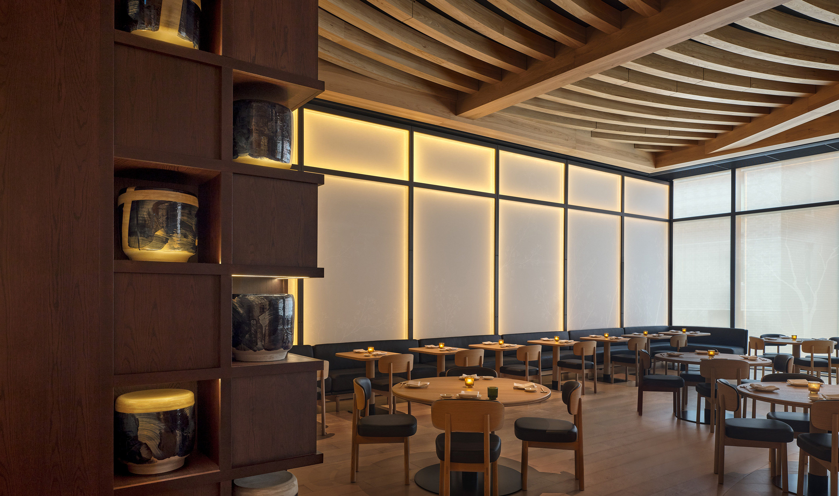 A Canada hospitality dining & social space with Lutron Sivoia and roller shades. © Joel Esposito