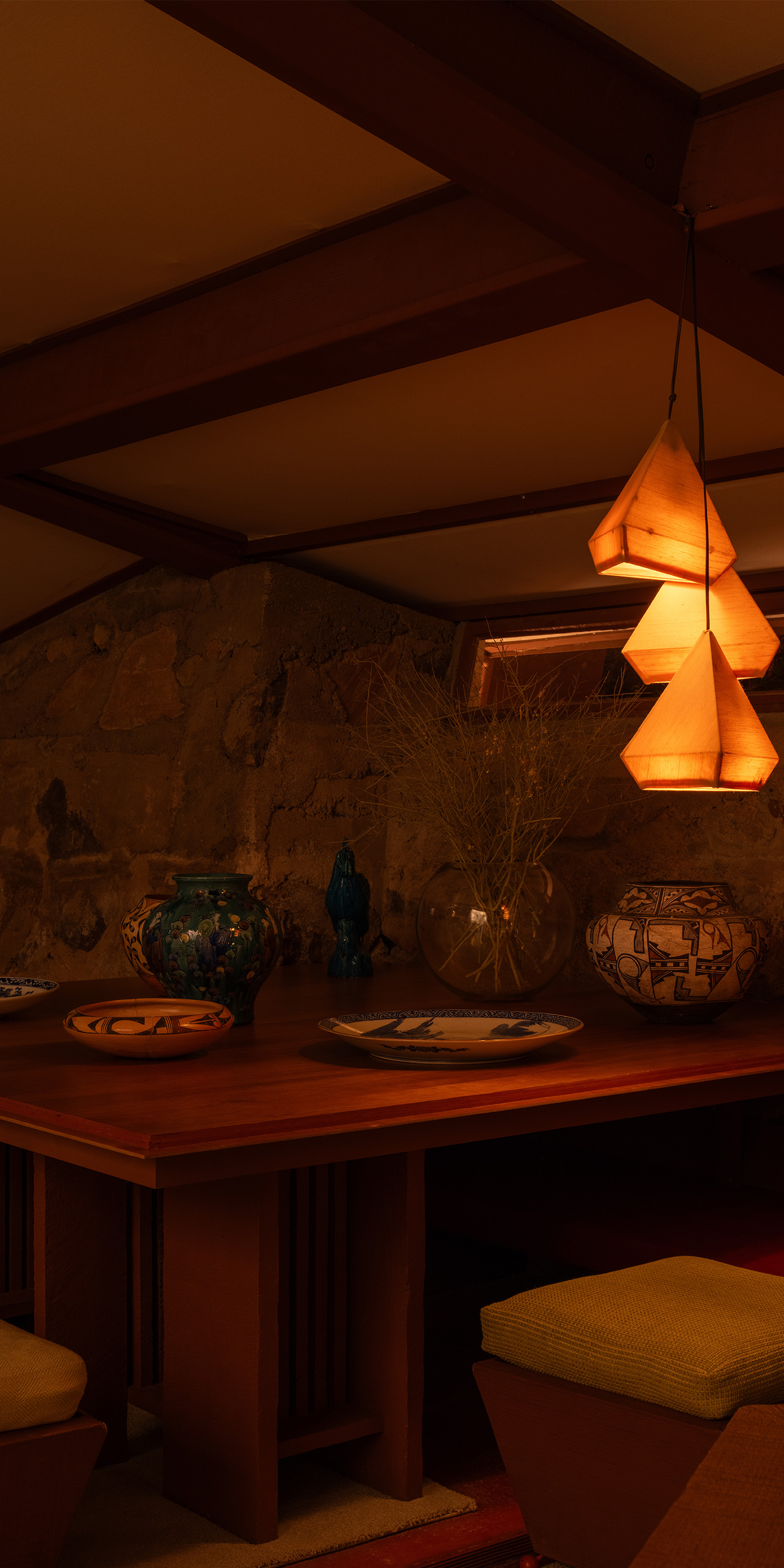 A Scottsdale residential dining room with Lutron Ketra lights, Roman shades, Sivoia and HomeWorks