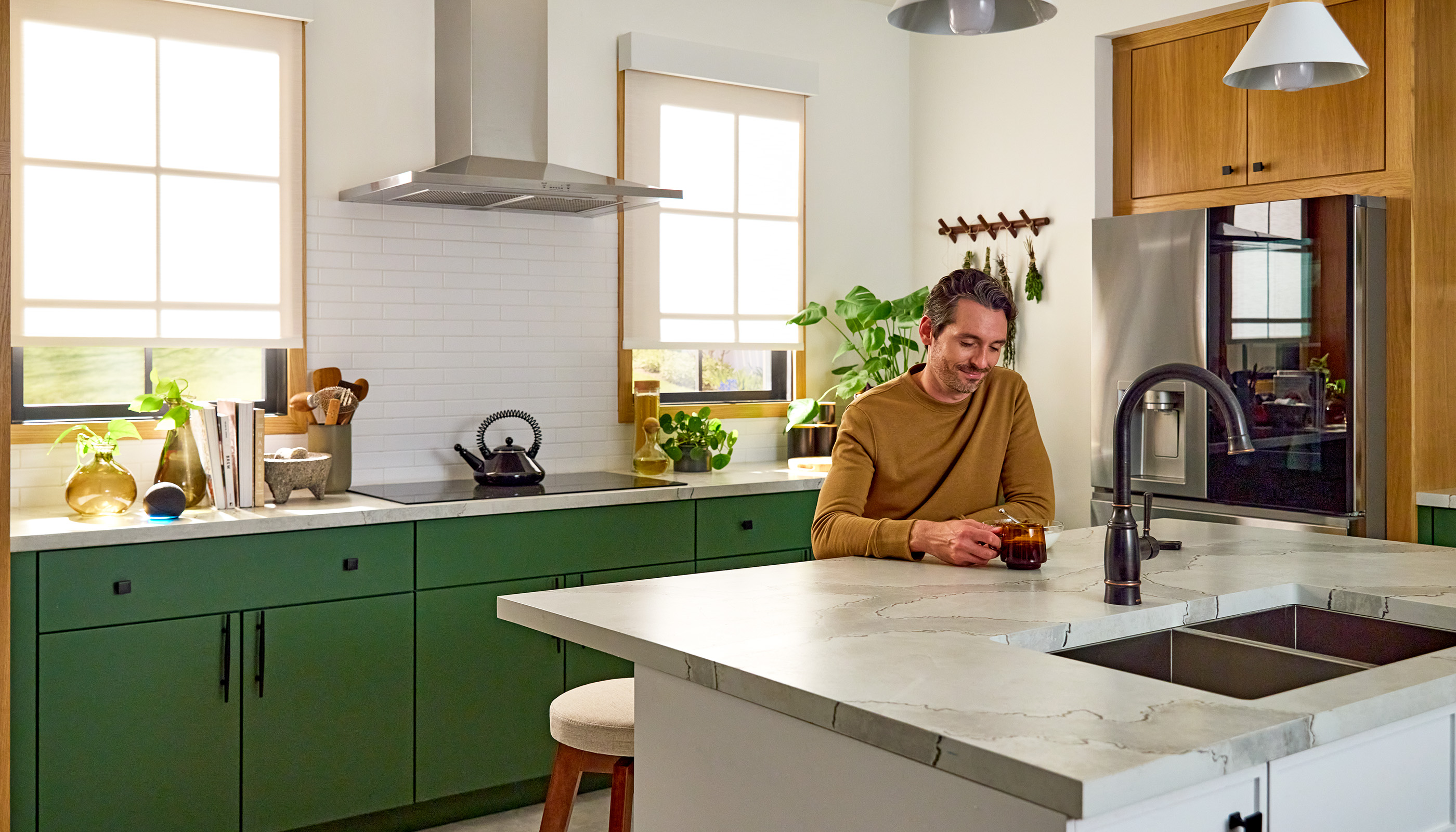 A Northeast private residence kitchen with Lutron Serena, Roller Shades