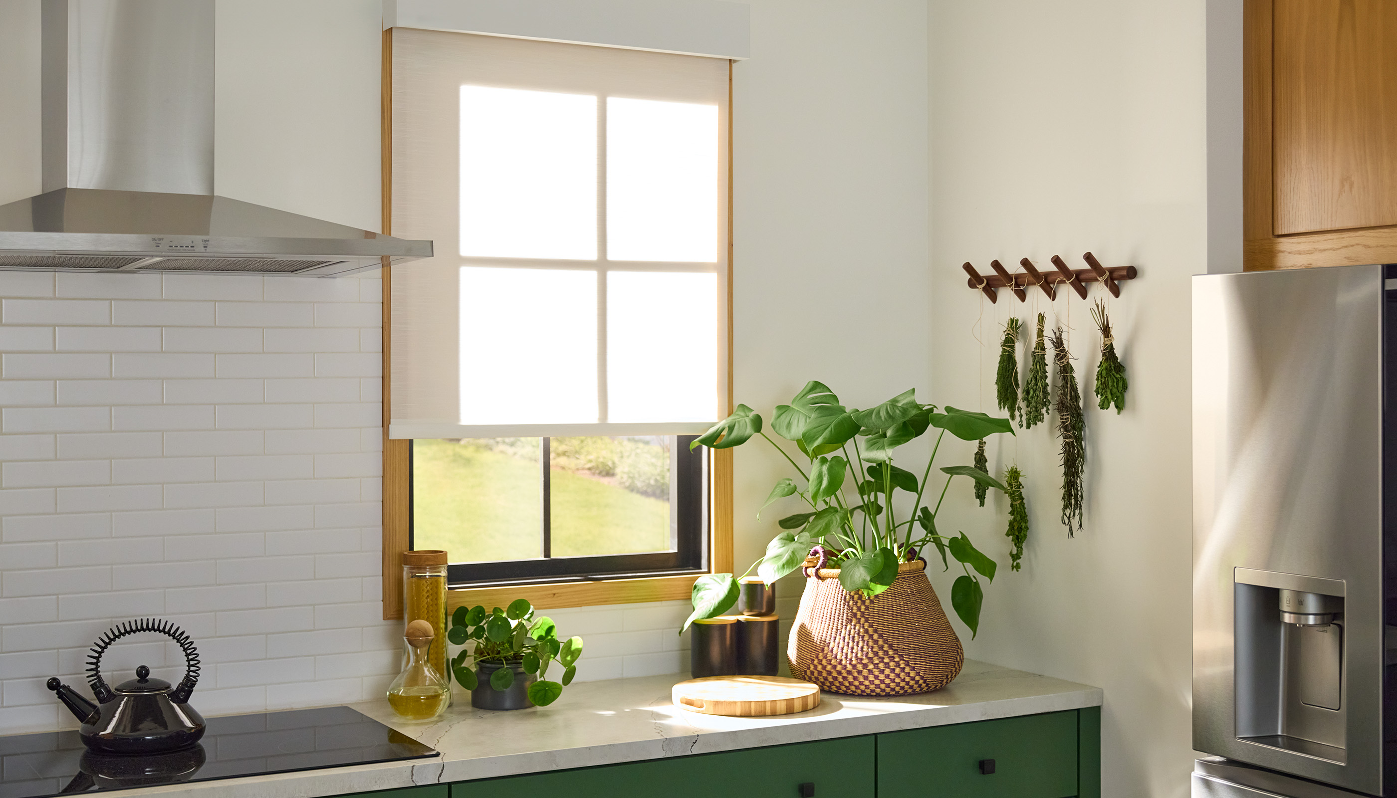 A Northeast private residence kitchen with Lutron Serena & Roller Shades
