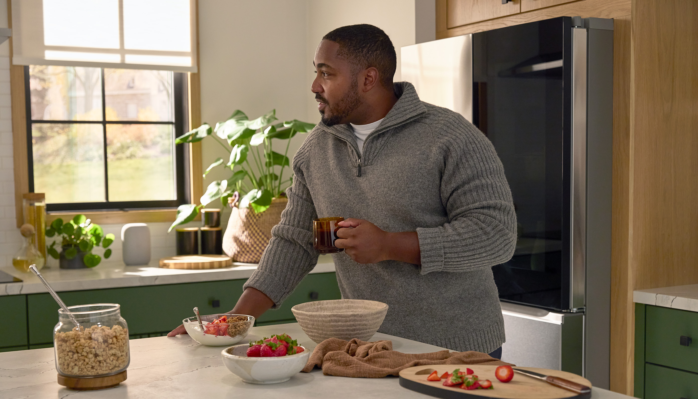 A Northeast private residence kitchen with Lutron Serena & Roller Shades