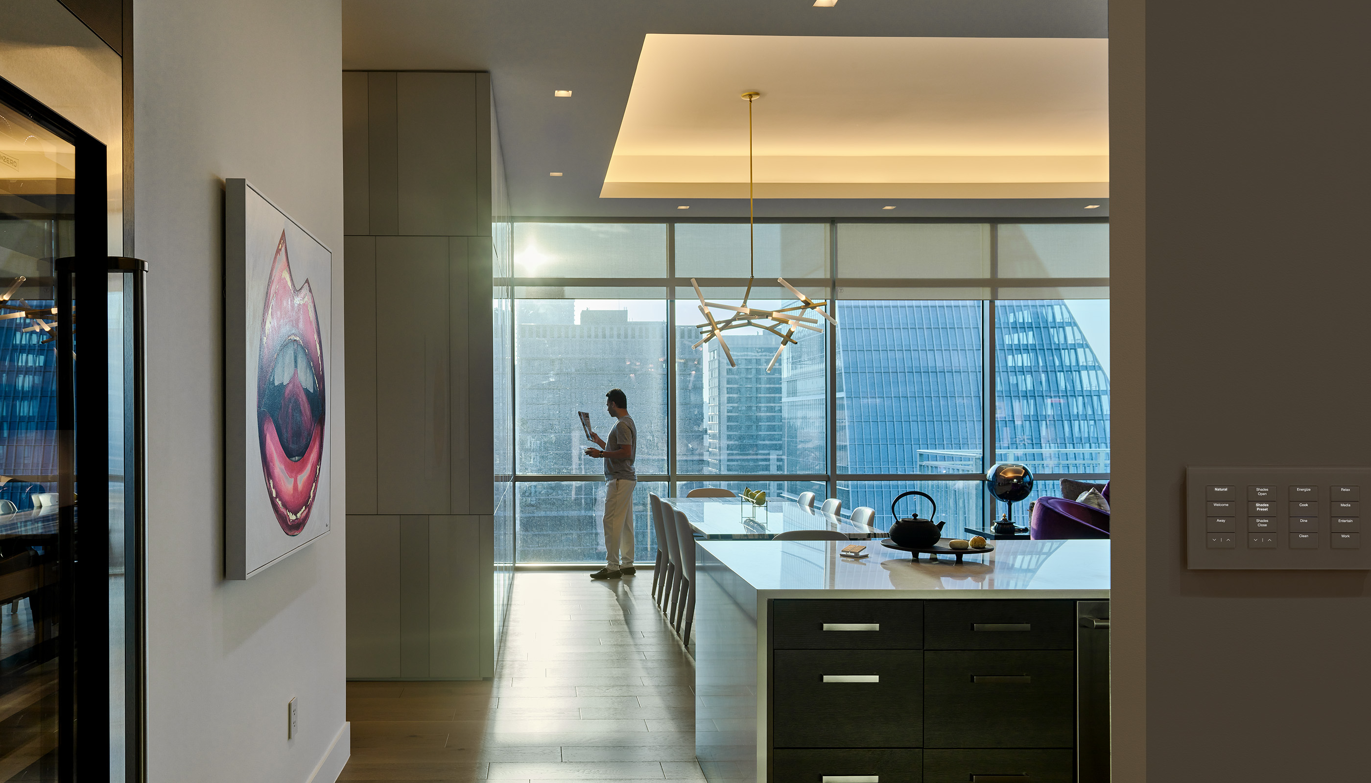 An Austin residential kitchen with Lutron Ketra lights, Roller shades, Palladiom, Keypads, Remotes  and HomeWorks