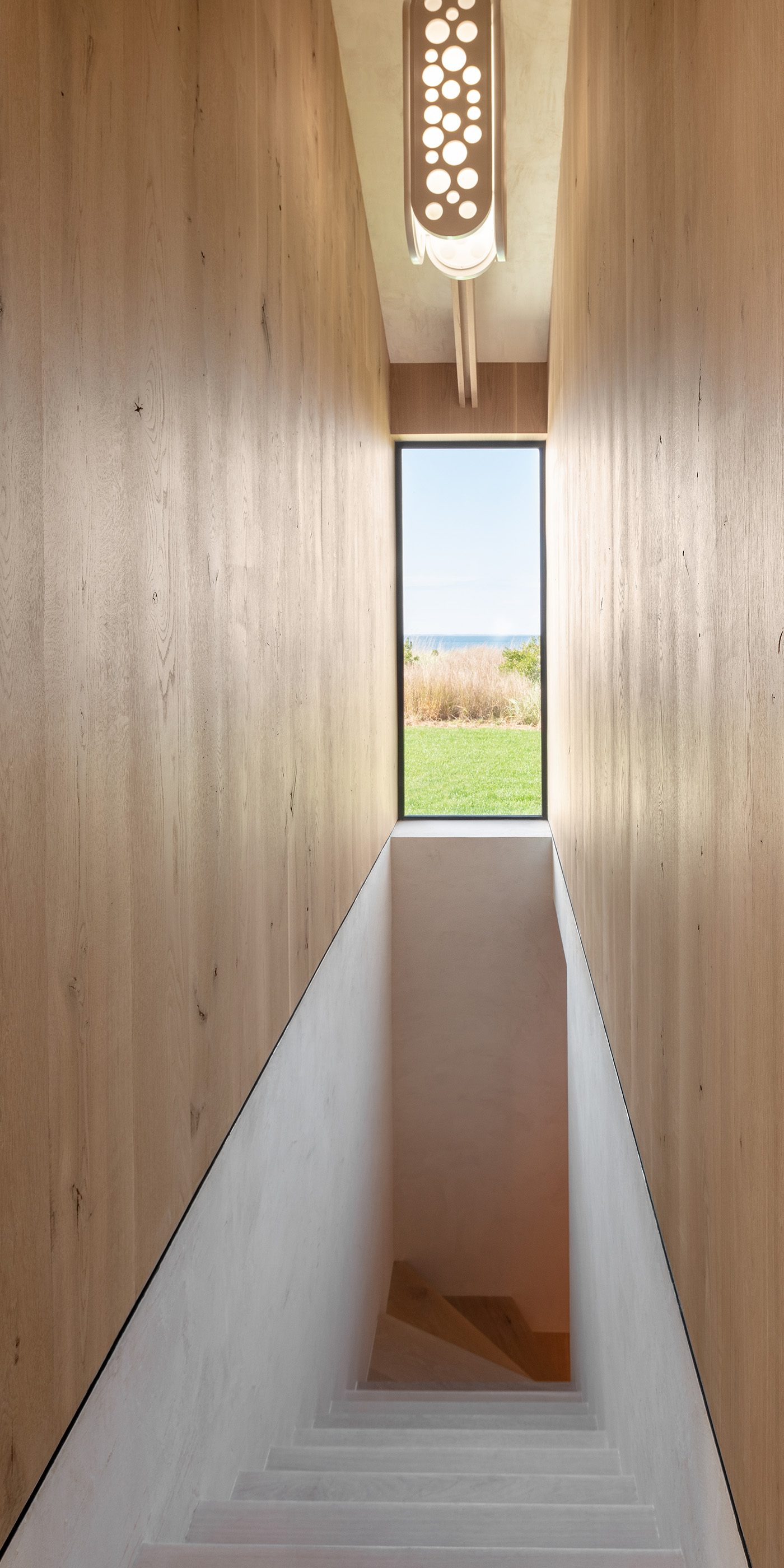 An East Hampton residential hallway with Lutron Alisse and HomeWorks. © Magda Biernat Photography