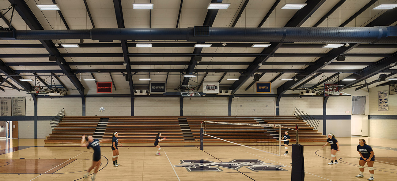 Volleyball players practice under upgraded LED lighting by Lutron in Moravian University's gymnasium
