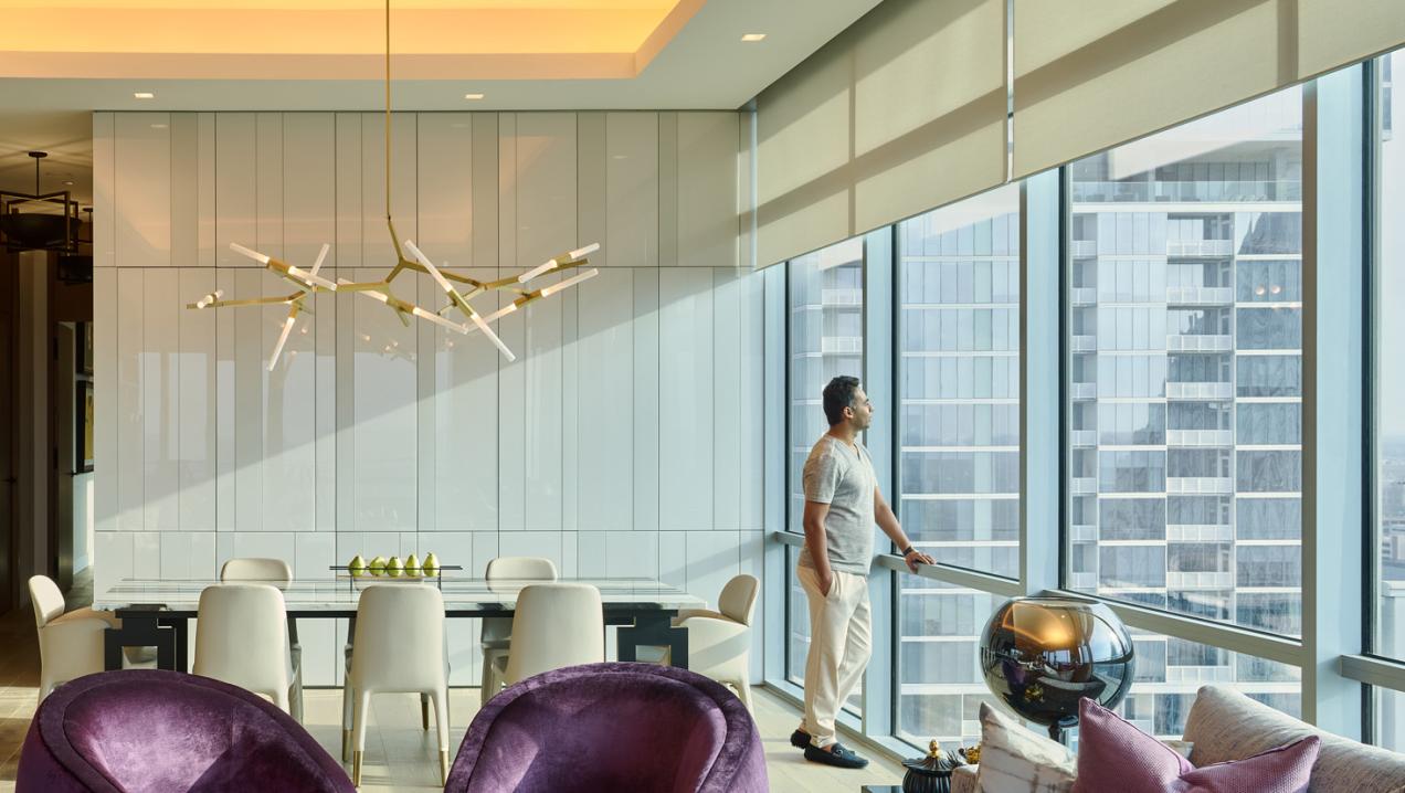 Lutron lighting in high-rise dining room harmonizing with natural light