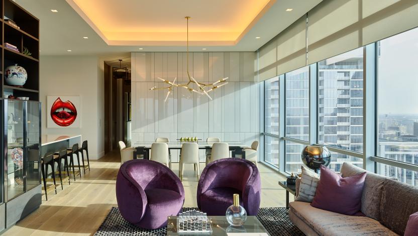 Luxury high-rise living room dining area with architectural cove lighting