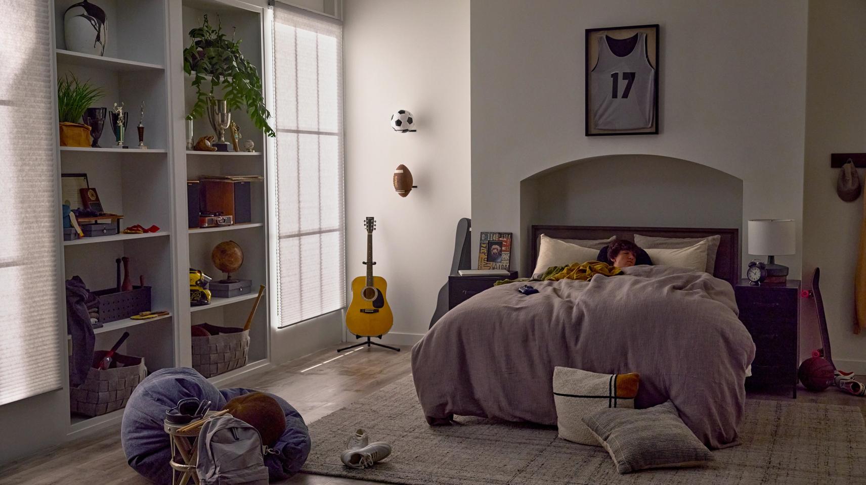 Teen bedroom with smart lighting and automated window shades working together