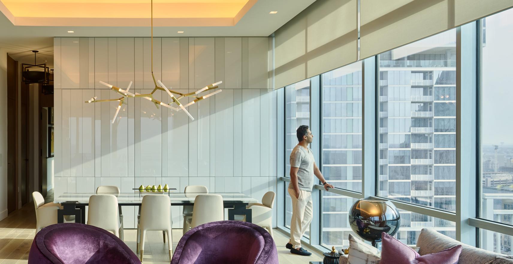 Lutron lighting in high-rise dining room harmonizing with natural light