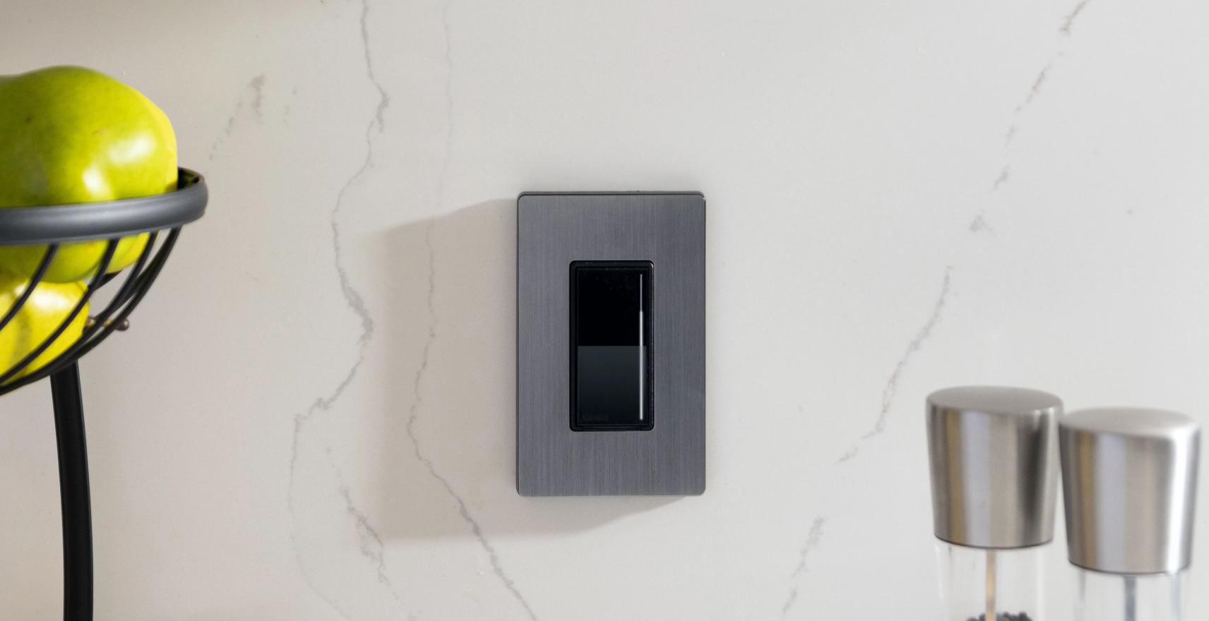 Lutron designer dimmer on marble wall creating uniform coordinated style