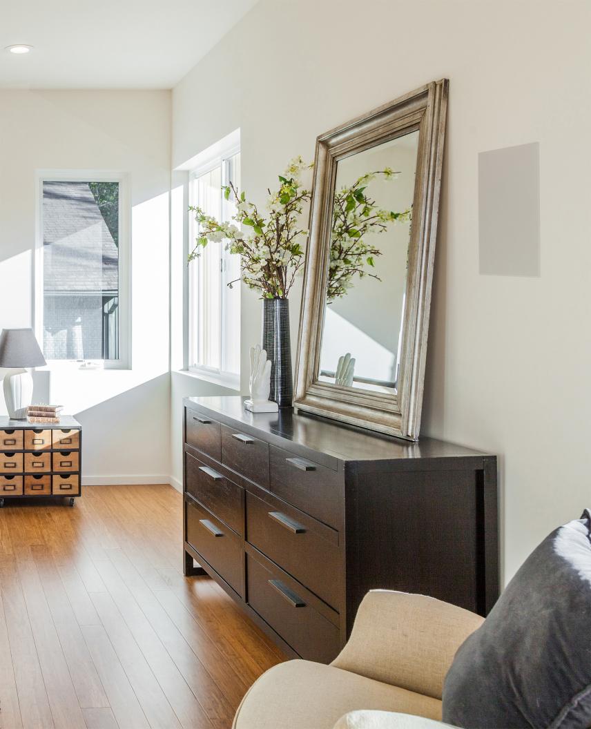 Lutron audio system integration for whole-home sound control in modern hallway