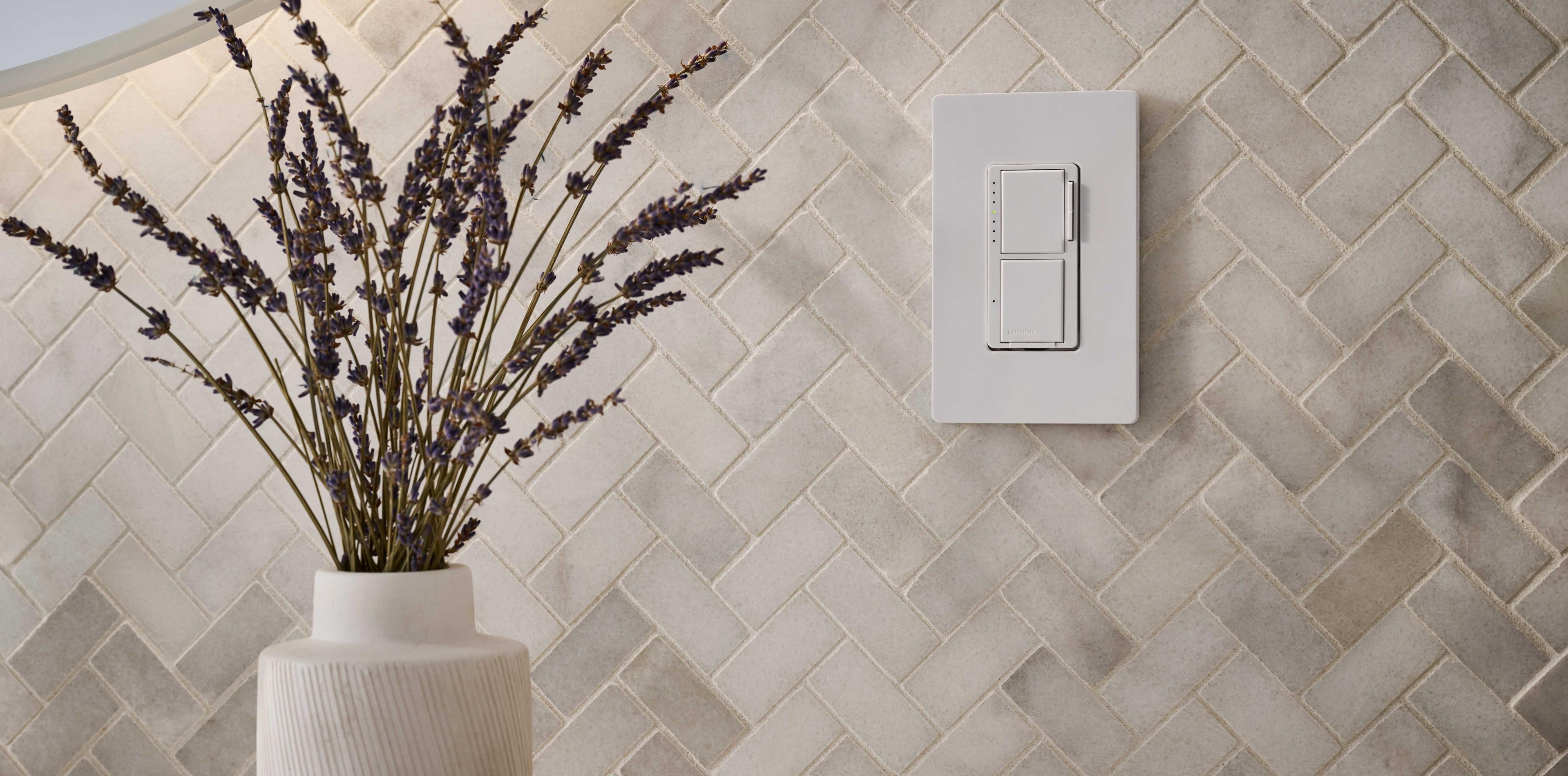 A close up image of a Maestro switch being used in a home setting.