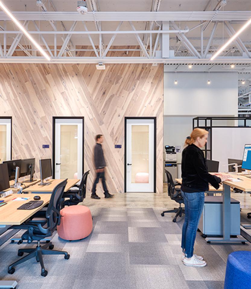 Employees work under Lutron lighting at Atlassian