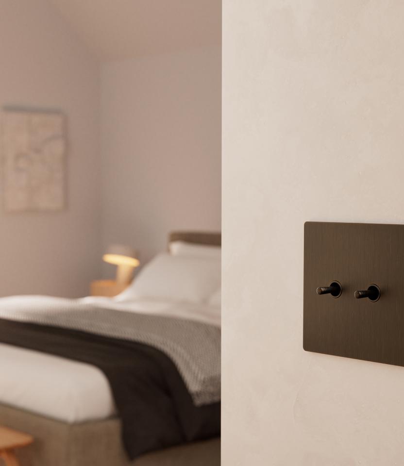 A California residential bedroom with Lutron roman shades and keypads & remotes.