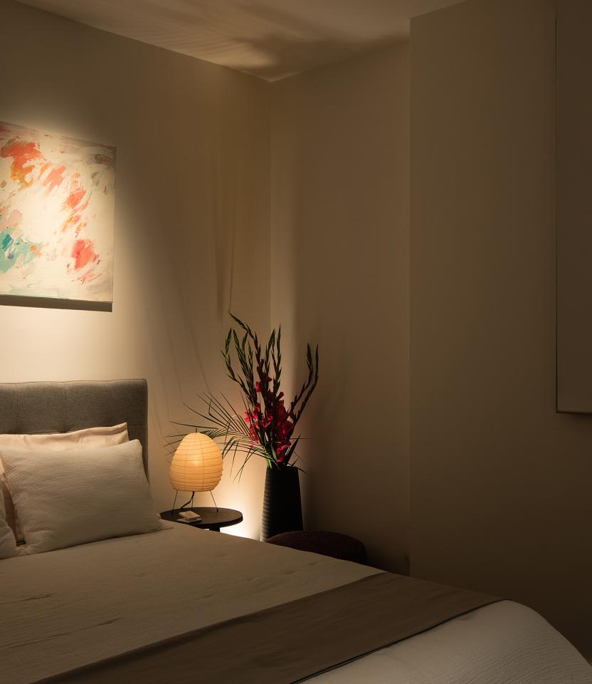 An Austin residential bedroom with Lutron Ketra lights and HomeWorks