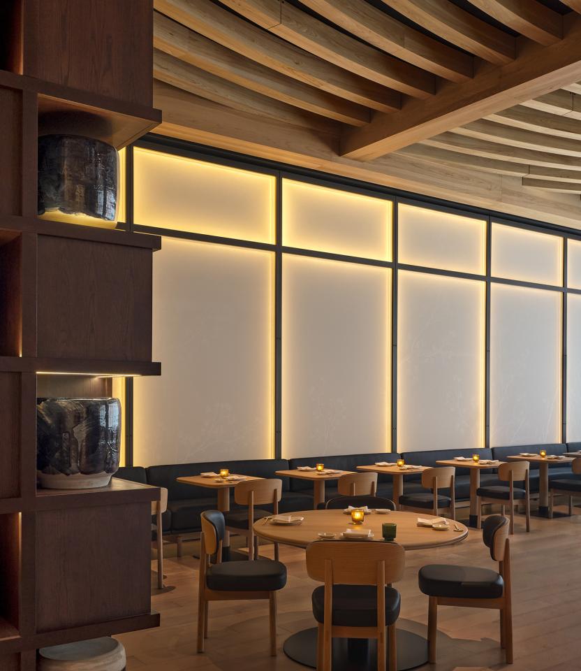 A Canada hospitality dining & social space with Lutron Sivoia and roller shades. © Joel Esposito