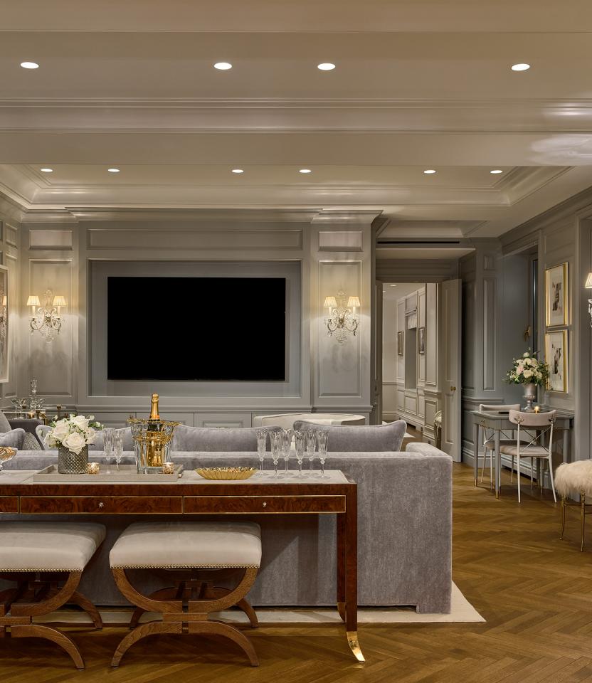 A New York City residential living room with Lutron downlights, Roller shades, Sivoia and HomeWorks