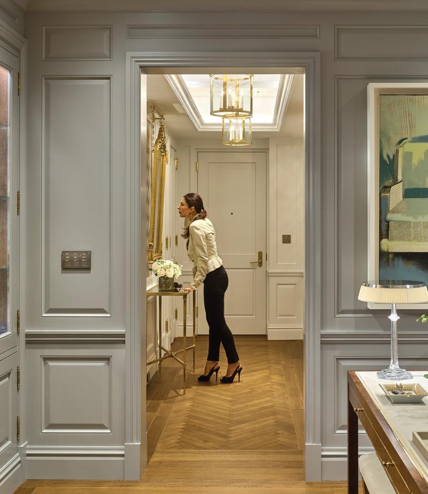 A New York City residential hallway with Lutron Palladiom and HomeWorks