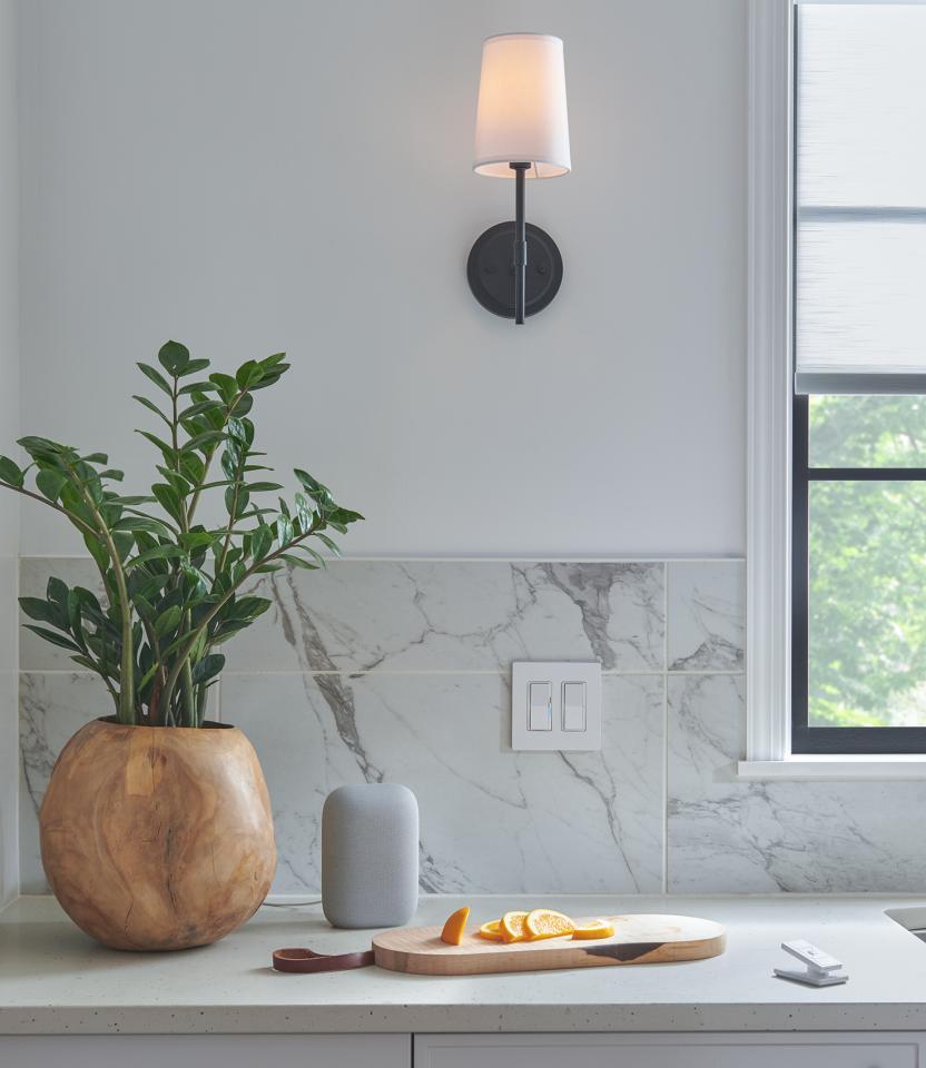 A Northeast private residence kitchen with Lutron Serena, Roller Shades, Caséta, Pico, and Dimmers & Switches.