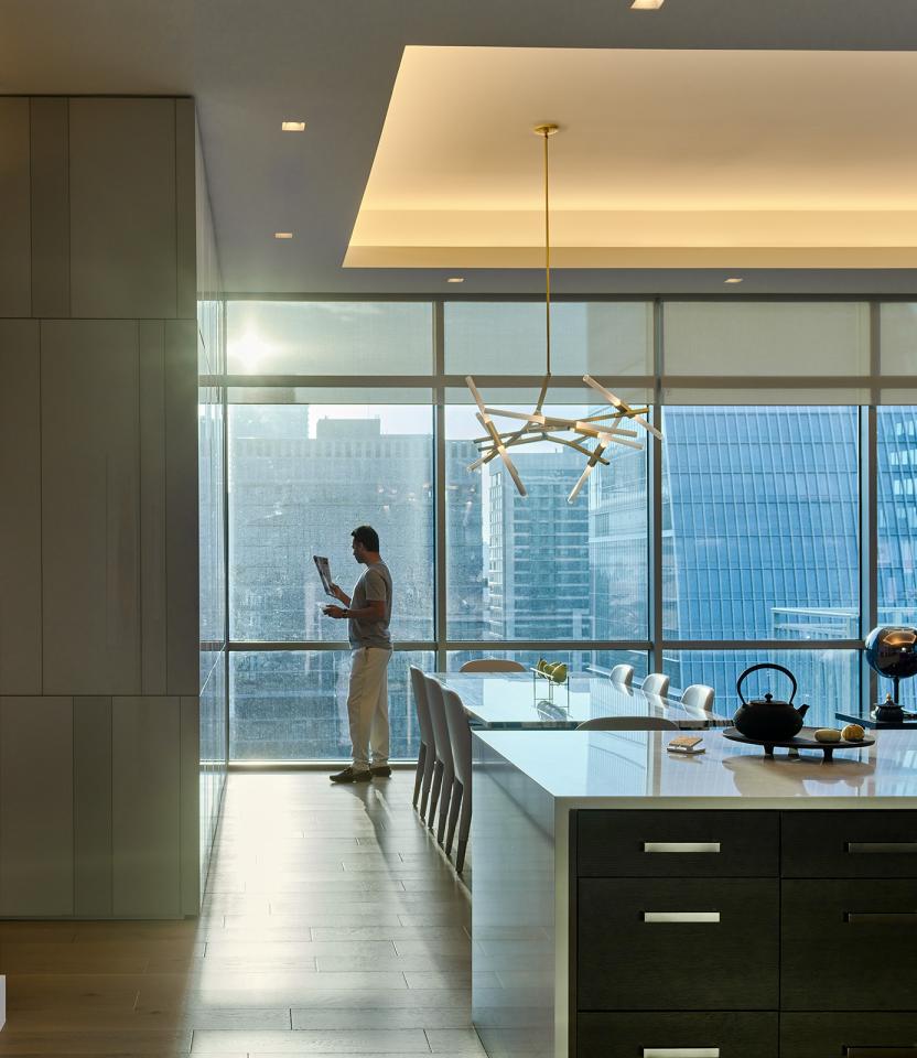 An Austin residential kitchen with Lutron Ketra lights, Roller shades, Palladiom, Keypads, Remotes  and HomeWorks