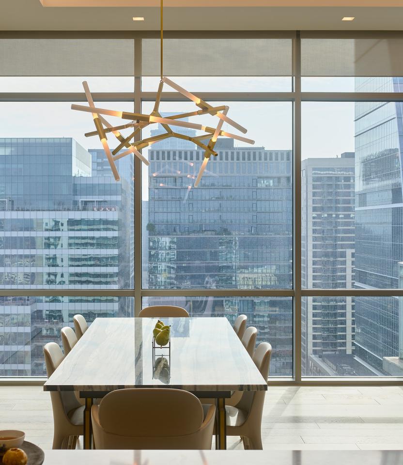 An Austin residential kitchen with Lutron Ketra lights, Palladiom roller shades, and Picos.
