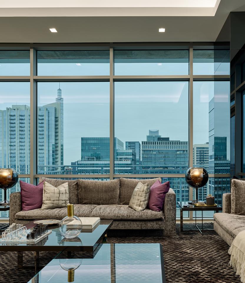 An Austin residence living room with Lutron Ketra lights, linears, Roller shades, Palladiom & HomeWorks