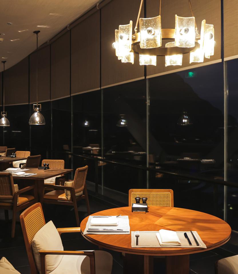 A China hospitality dining & social space with Lutron roller shades.