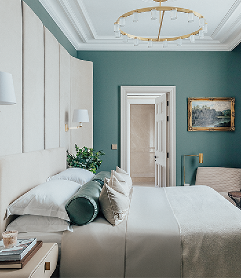 a guestroom with lutron controls and drapes