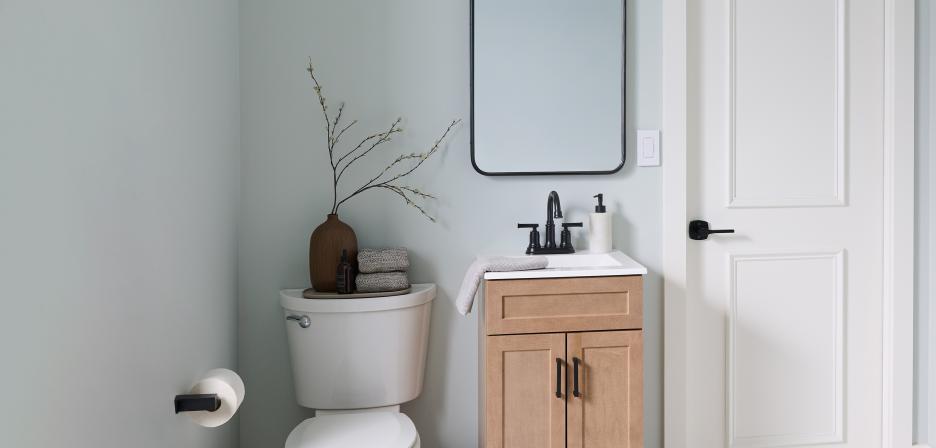 Modern powder room featuring a wall-mounted Timer Switch near the sink.
