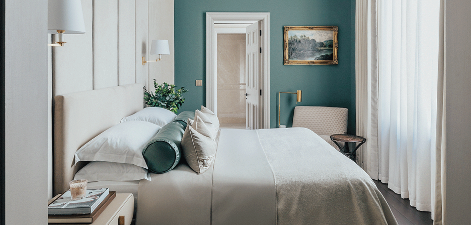 An opulent guest room with Lutron drapes and controls