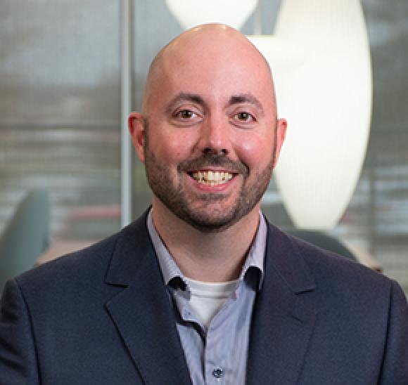 A headshot of Chris Udall of Lutron