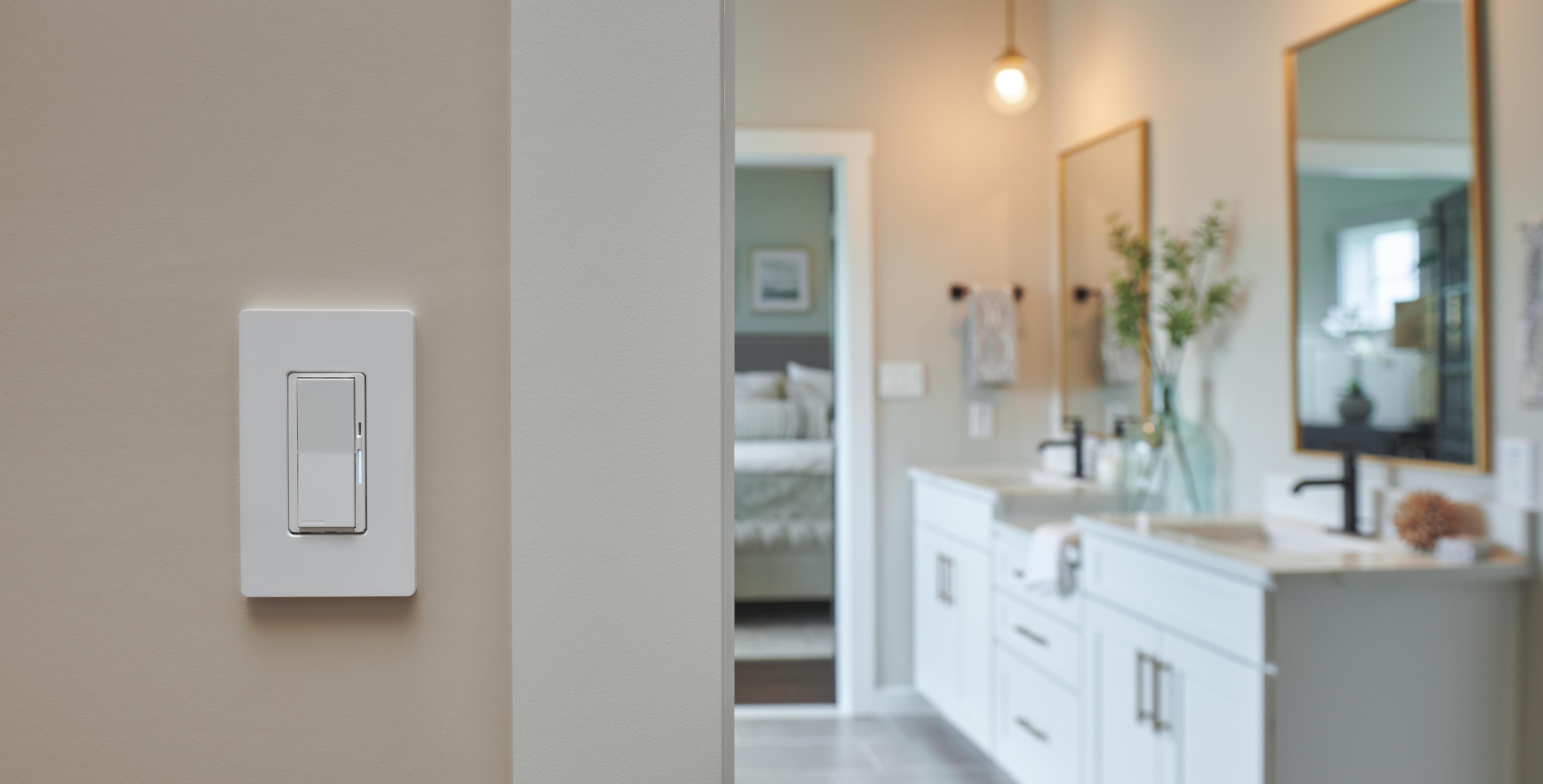 A bathroom switch is easy to find with a soft-glow indicator light.