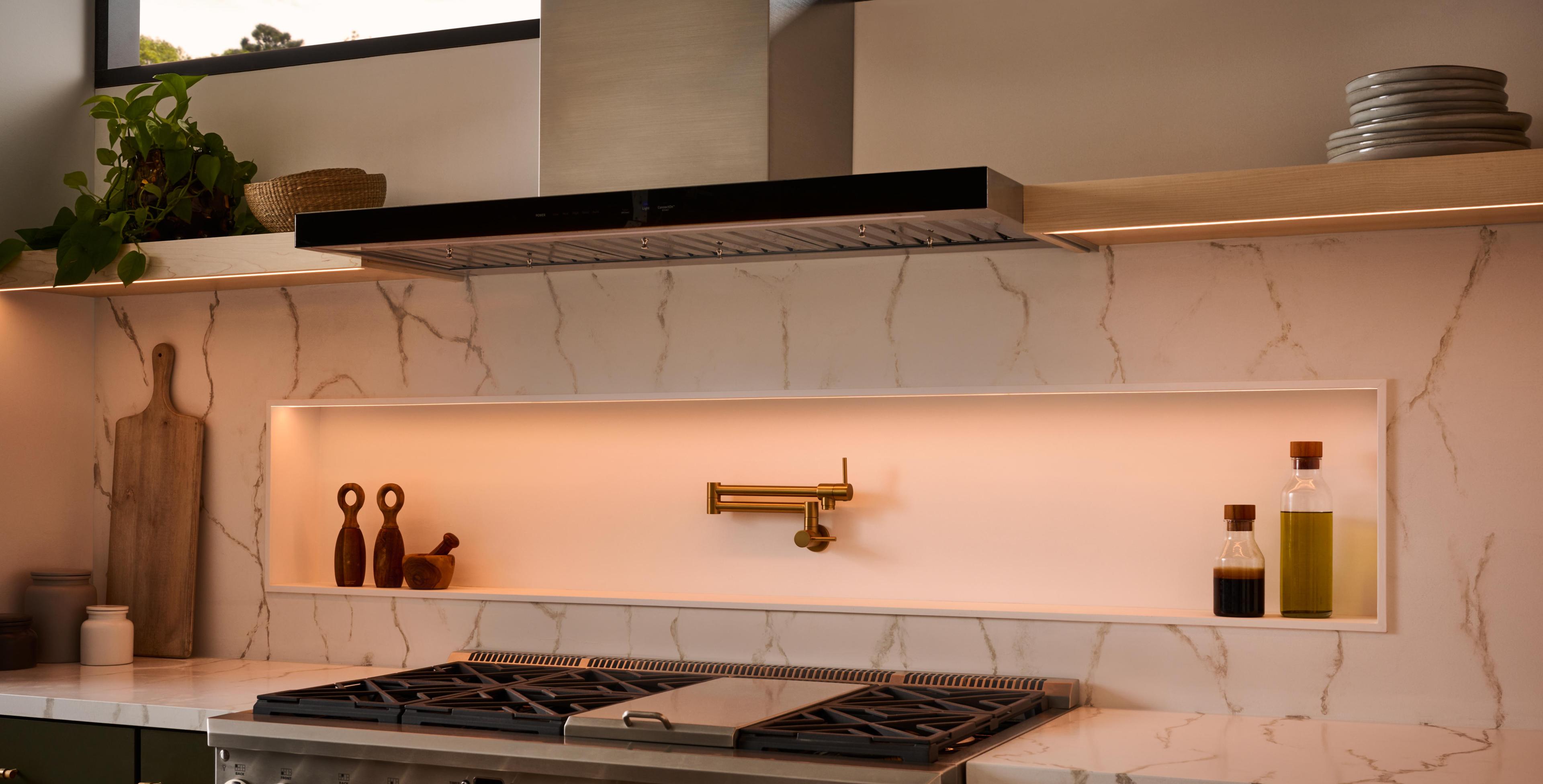 A warm, ambient lighting sets the mood in a kitchen through the use of dimmable tape light.