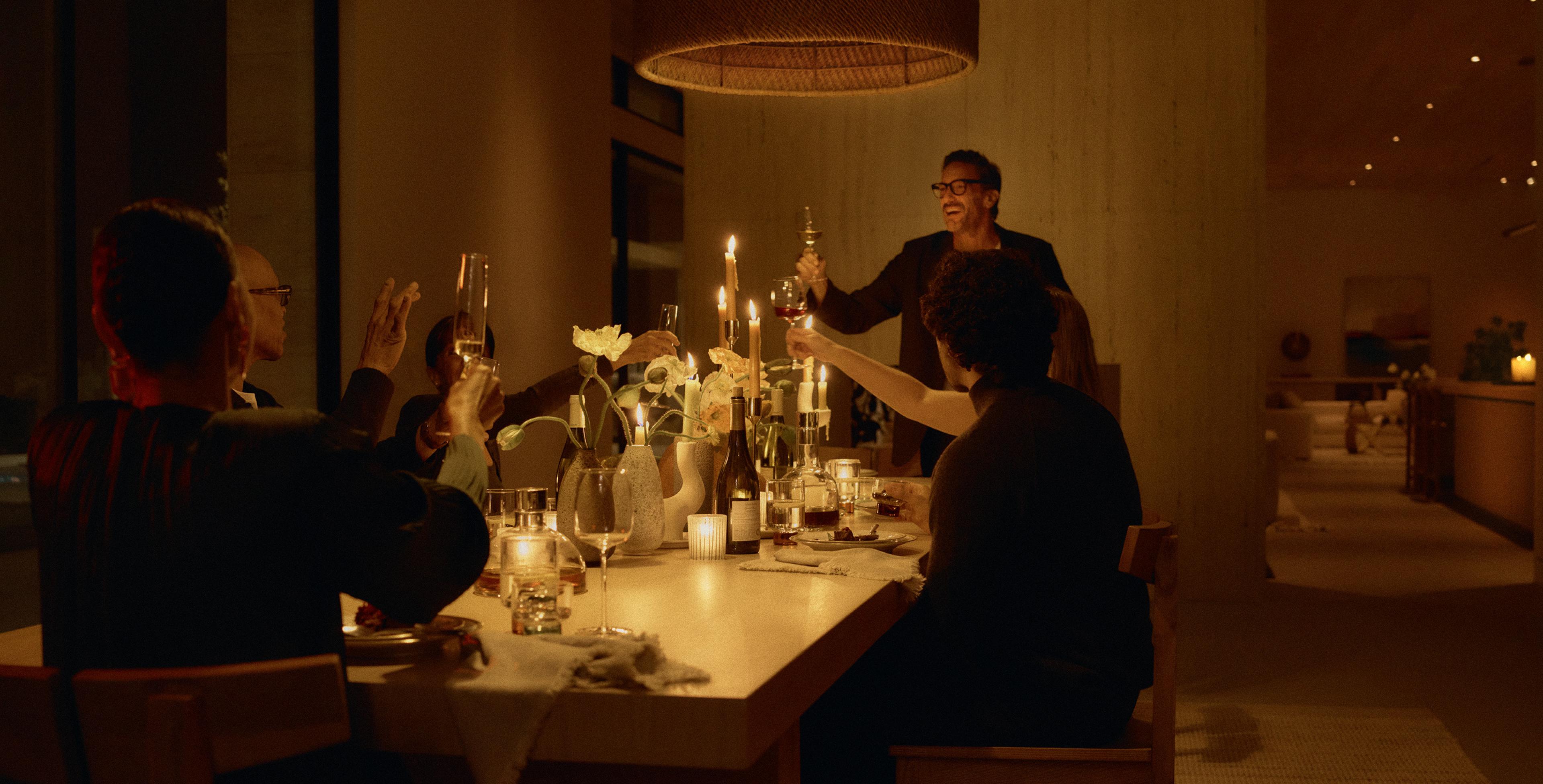 HomeWorks Entertaining scene in a dining room with automated ambient lighting