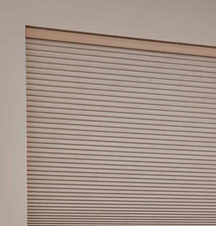 Triathlon architectural honeycomb cellular shade, a wireless motorized smart window treatment