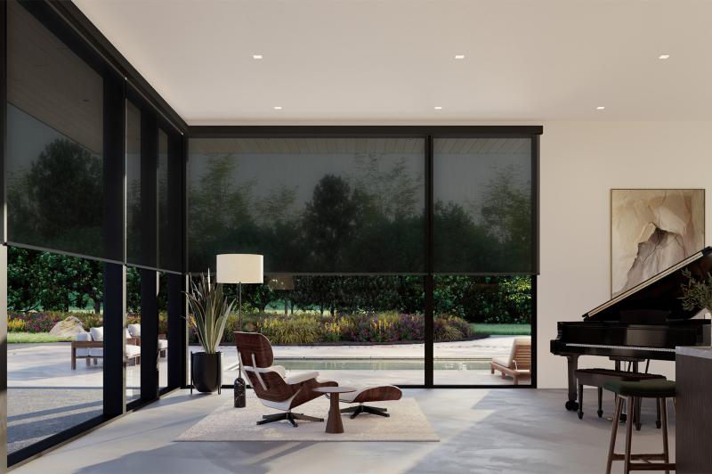 Whisper-quiet shades move together across the living room’s floor-to-ceiling windows to filter sunlight and increase privacy.