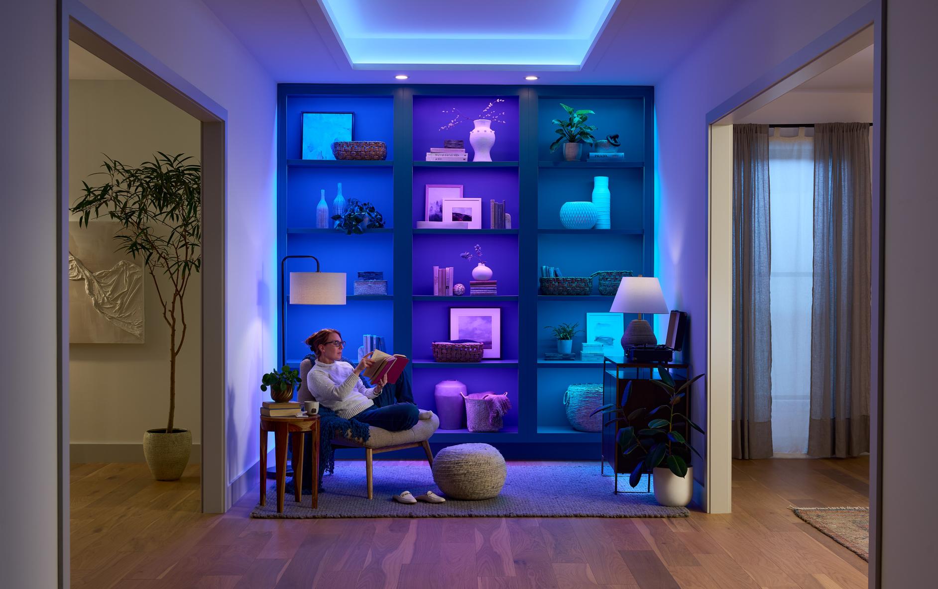 Lumaris RGB + tunable white tape light used in a sitting room and set to blue and purple lighting. 