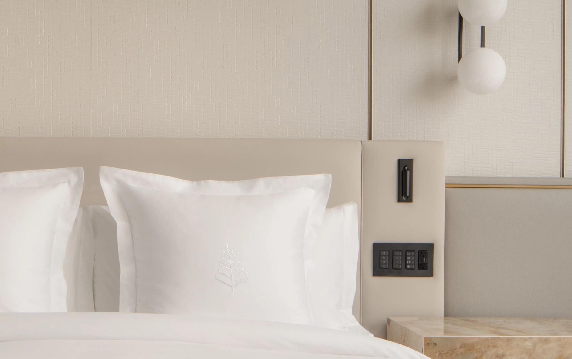 Sunnata ergonomic keypad with LED light bars mounted beside hotel bed for easy room control